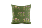 Green pillow with floral pattern on a white background