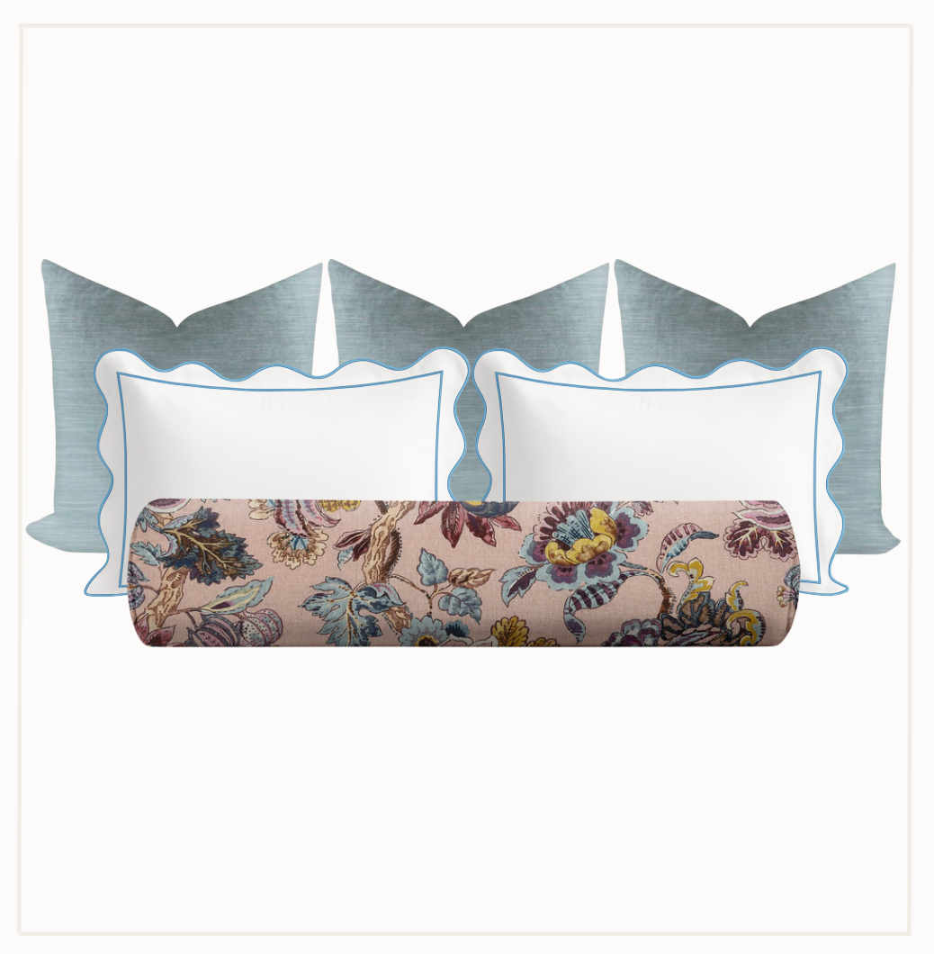 Floral duvet with decorative pillows on a white background