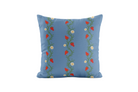Decorative pillow with a strawberry vine pattern in blue and red 