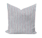 Striped pillow with purple and blue pattern on a white background