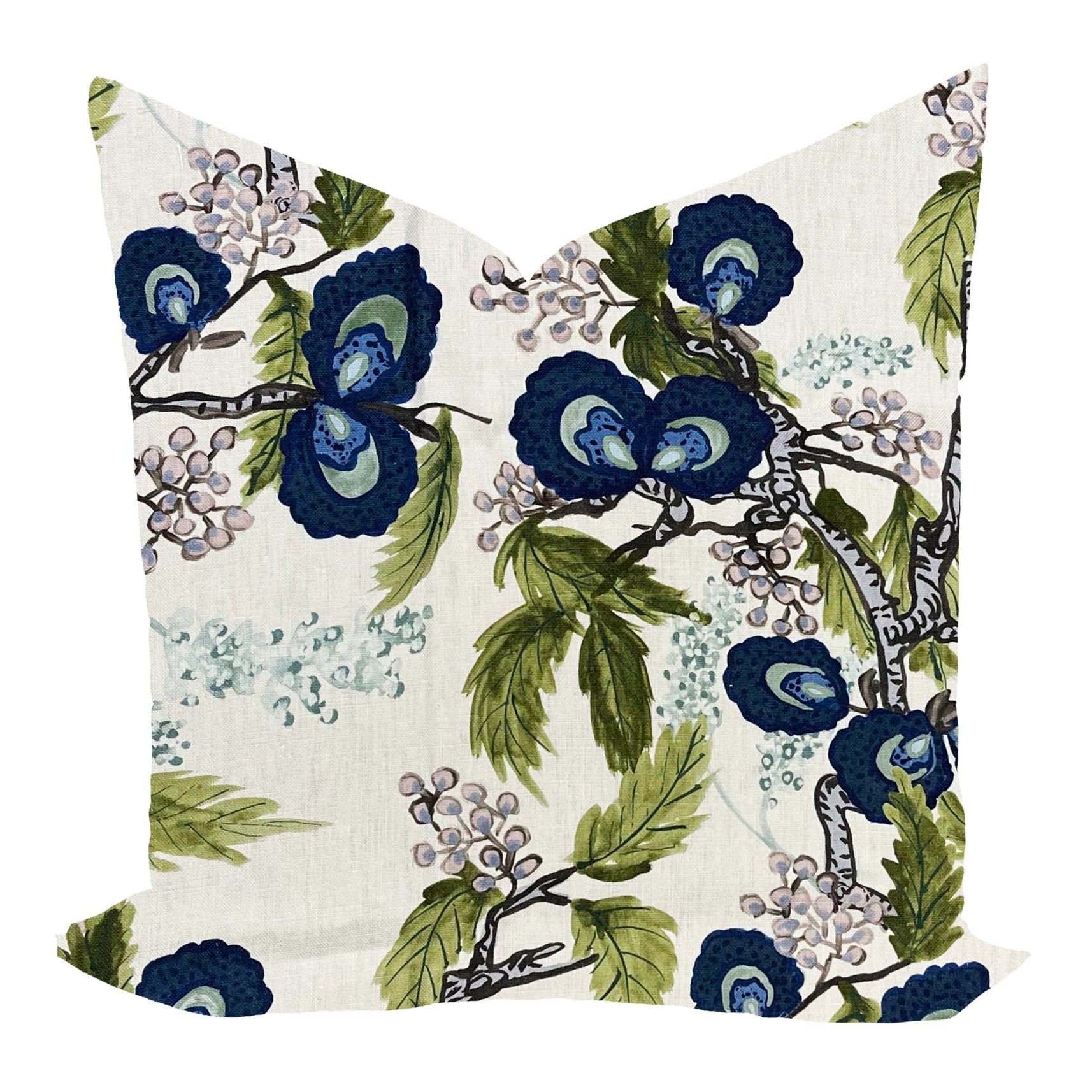 Floral pillow with blue flowers and green leaves on a white background