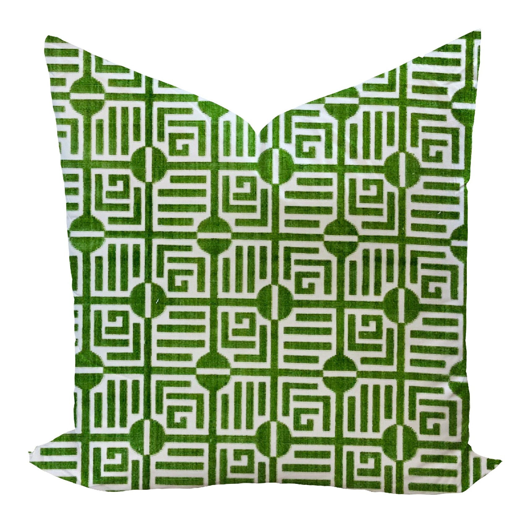 Green and white patterned pillow on a white background