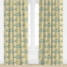 Curtains with a fish pattern in green and beige on a white background