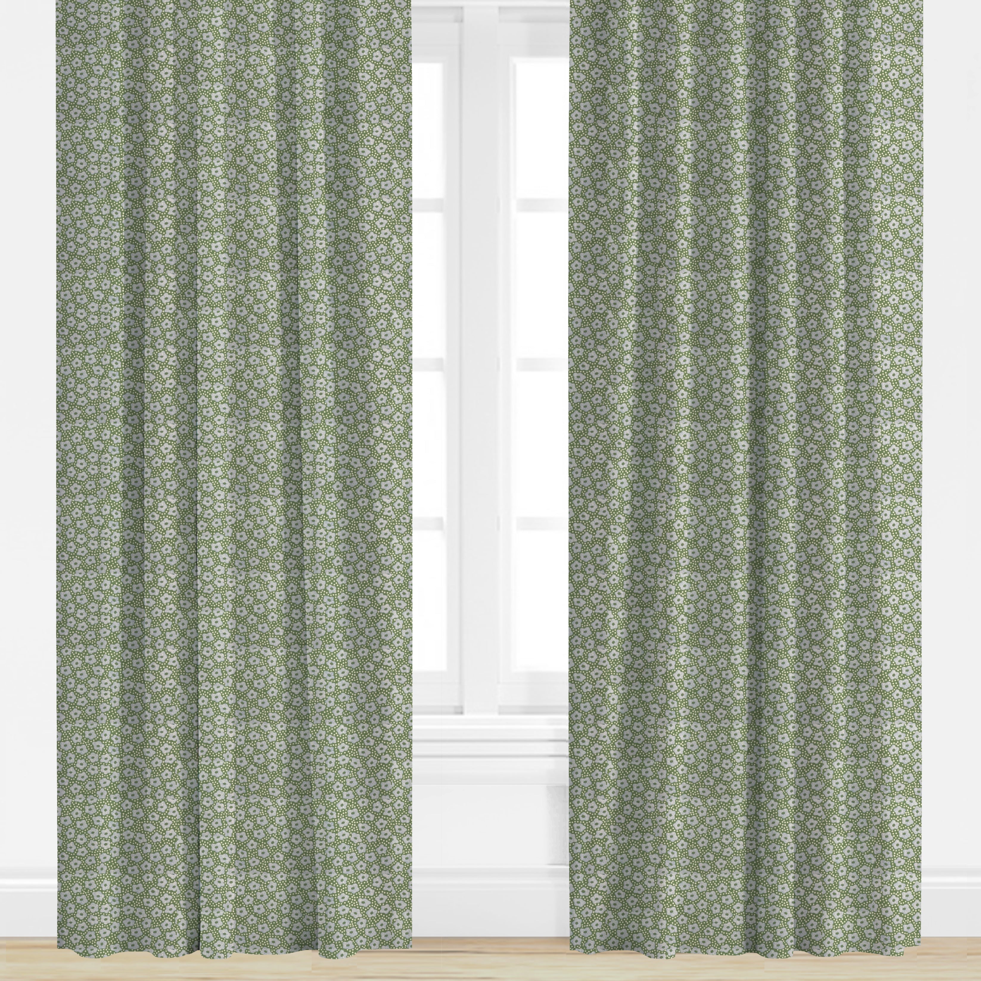Green and blue floral patterned curtains on a white window background