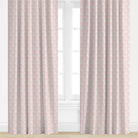 Patterned pink curtains on a white background