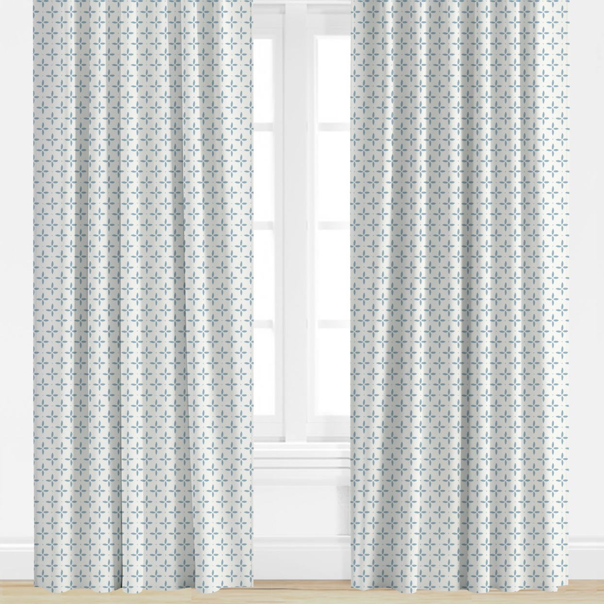 blue Patterned curtains on a window with a light background