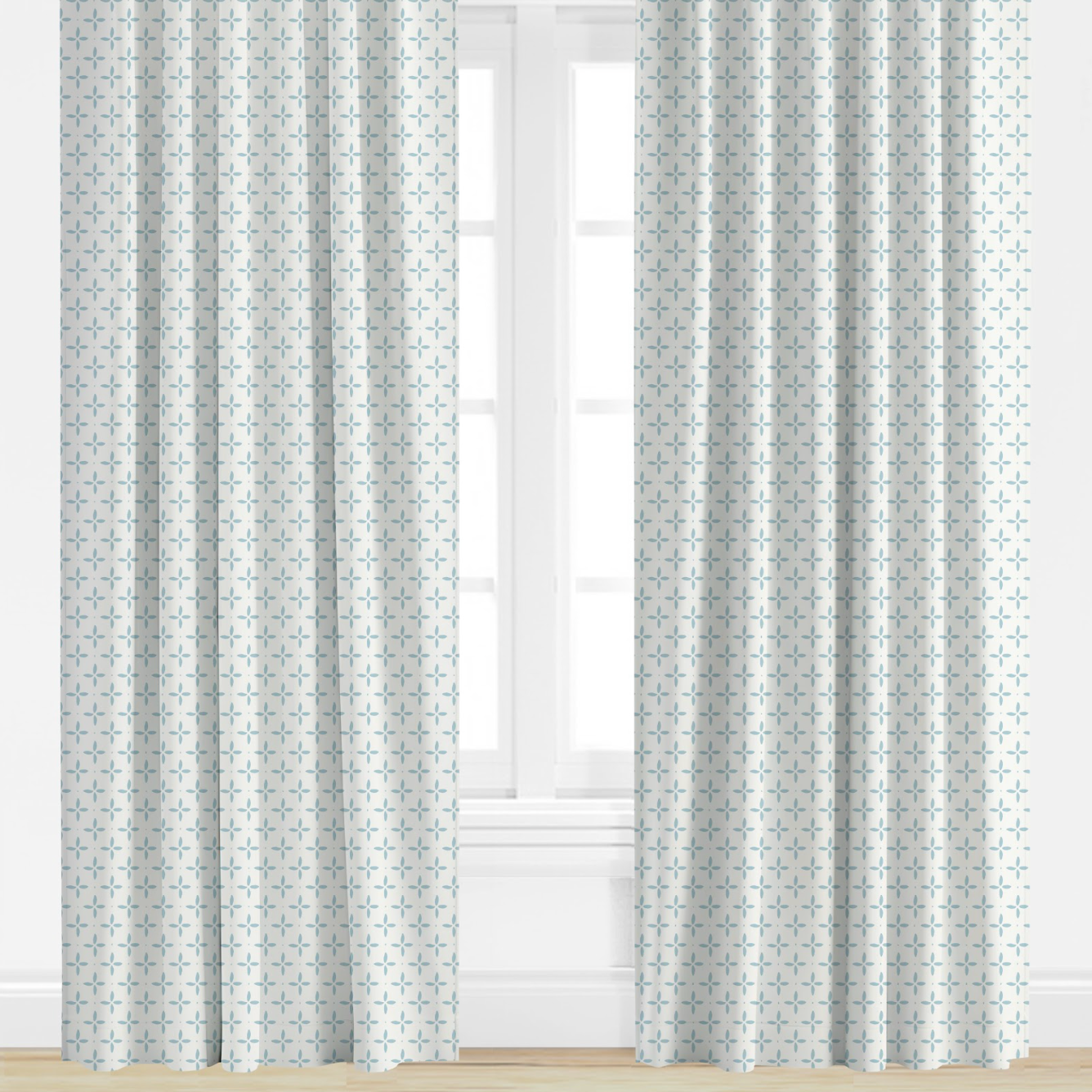 light blue Patterned curtains on a window with a light background