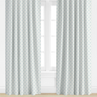 light blue Patterned curtains on a window with a light background