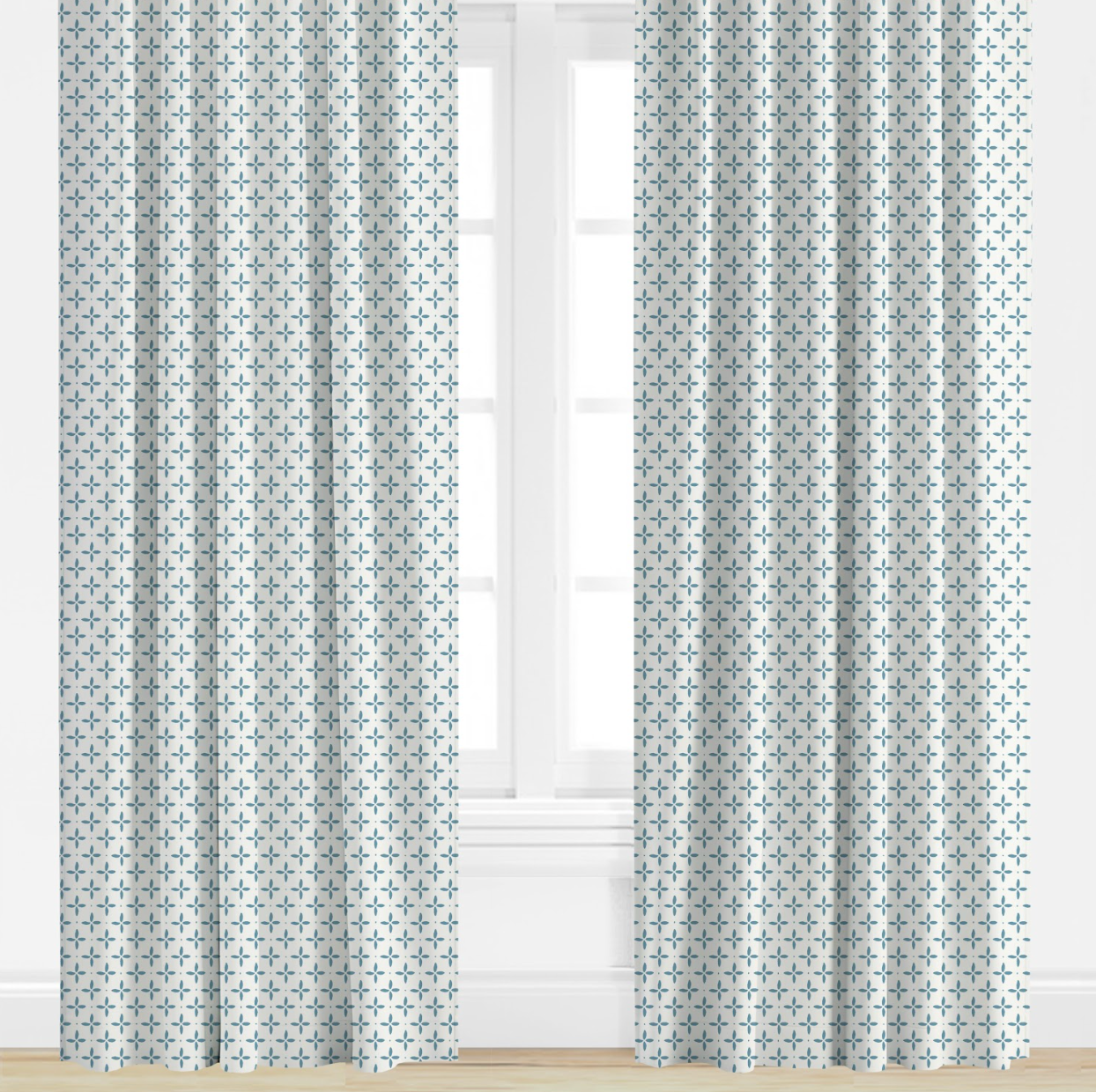 Blue Patterned curtains on a window with a light background