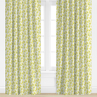 Yellow floral curtains with a white window in the background