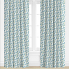 Blue Floral patterned curtains on a window with a light background