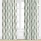 Green, leaf Patterned curtains on a window with a white background