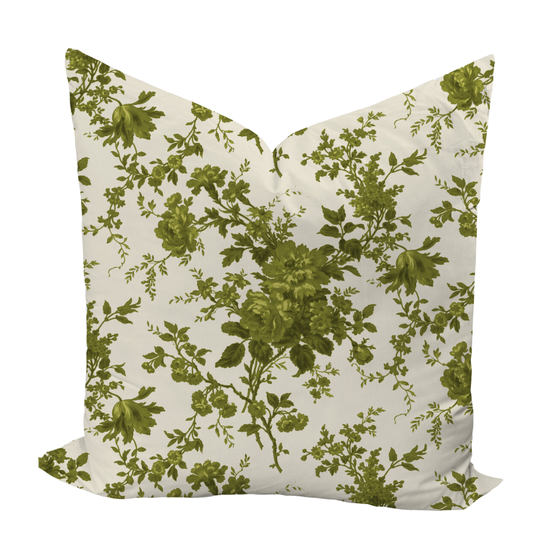Floral patterned pillow with green leaves on a white background