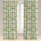 A pair of custom-length drapery panels featuring a green and white leaf pattern, with a 4-inch header and buckram detail.