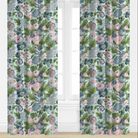 Floral patterned curtains with pink and blue flowers on a light background.